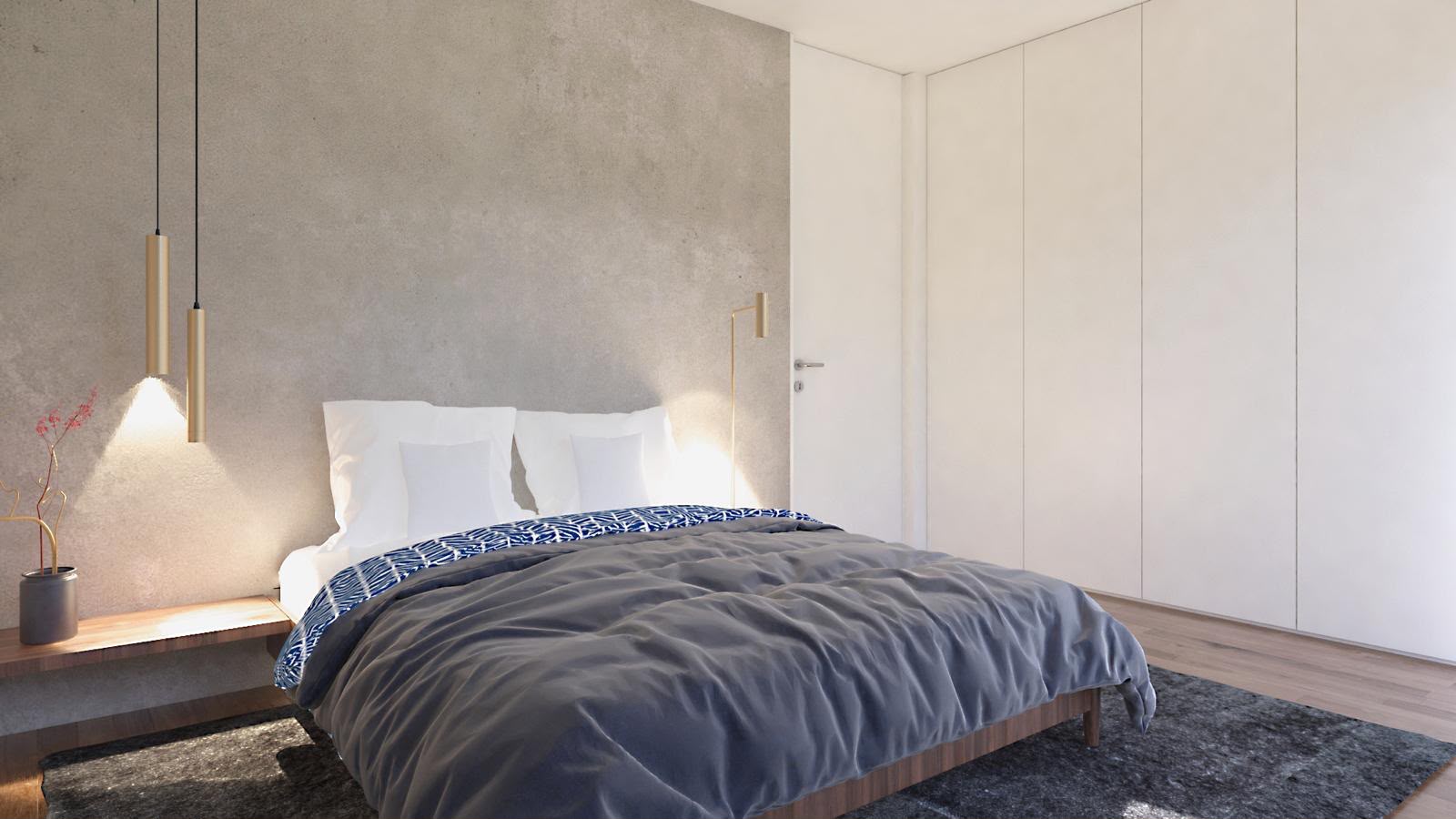 Quarto principal com parede em microcimento e candeeiros de leitura em latão